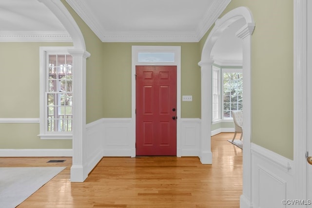 5904 Fox Crest Pl, Midlothian, VA 23112 - foyer entrance with arched walkways, light wood-type flooring, wainscoting, and ornamental molding
