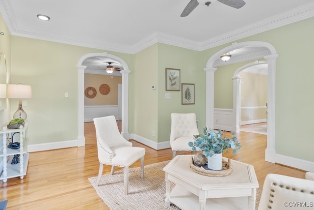 5904 Fox Crest Pl, Midlothian, VA 23112 - living area featuring ceiling fan, decorative columns, arched walkways, light wood finished floors, and ornamental molding