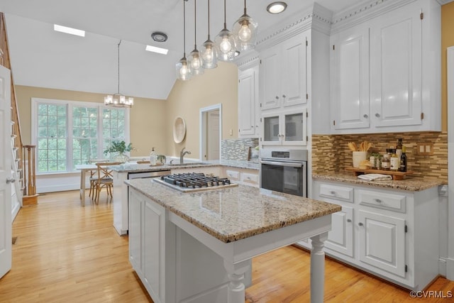 5904 Fox Crest Pl, Midlothian, VA 23112 - kitchen with appliances with stainless steel finishes, a peninsula, a sink, white cabinetry, and a chandelier