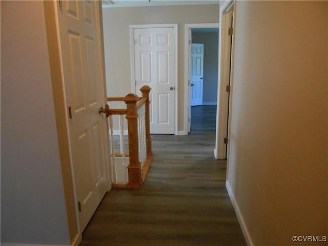 15212 Fairen Ln, South Chesterfield, VA 23834 - hallway featuring dark wood-style flooring, an upstairs landing, and baseboards
