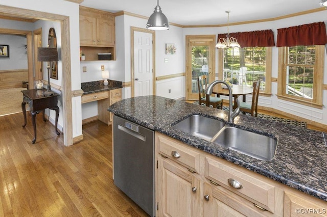 kitchen with dishwasher, a sink, light brown cabinets, light wood-style floors, and wainscoting