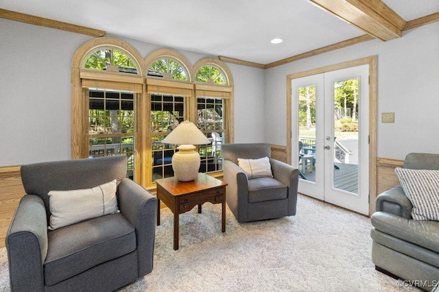 living area with french doors, healthy amount of natural light, beamed ceiling, carpet floors, and recessed lighting