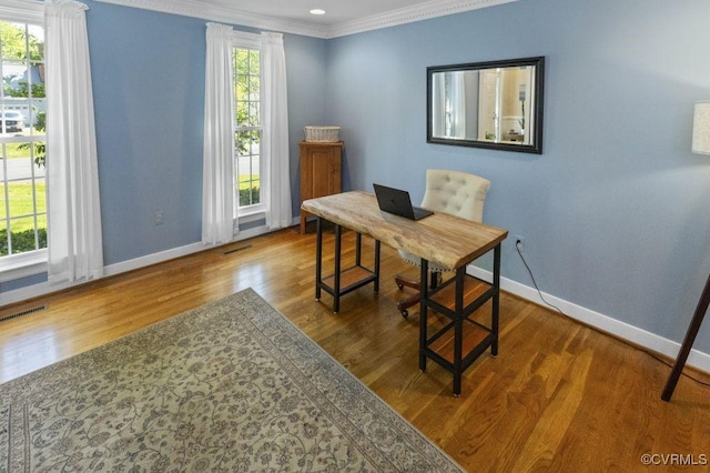 office space featuring baseboards, ornamental molding, wood finished floors, and recessed lighting
