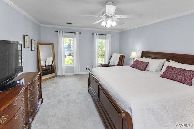 bedroom with light colored carpet, ornamental molding, baseboards, and a ceiling fan