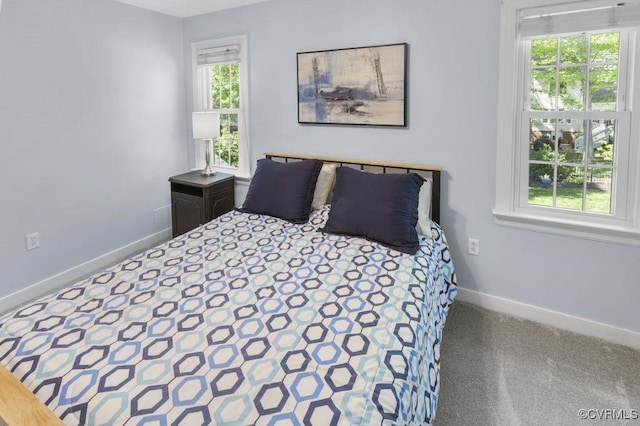 carpeted bedroom with baseboards