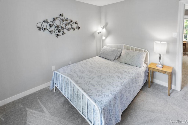 carpeted bedroom featuring baseboards