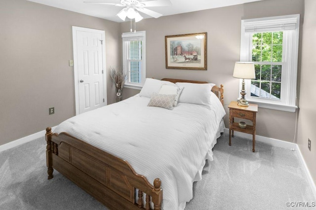 bedroom with baseboards, carpet flooring, and a ceiling fan
