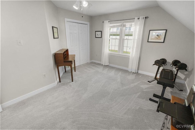 sitting room featuring light carpet, a ceiling fan, lofted ceiling, and baseboards