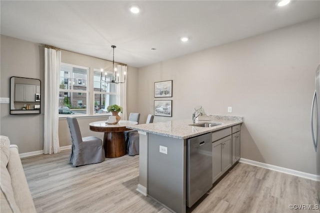 6008 Banyan Ln, Chesterfield, VA 23234 - kitchen with a sink, stainless steel dishwasher, gray cabinetry, a chandelier, and light wood-type flooring