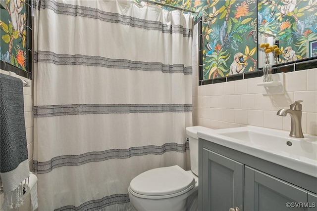 full bathroom with decorative backsplash, toilet, tile walls, vanity, and a shower with curtain
