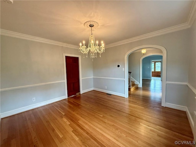 4210 Wistar Rd, Henrico, VA 23228 - empty room with arched walkways, wood finished floors, a chandelier, ornamental molding, and baseboards
