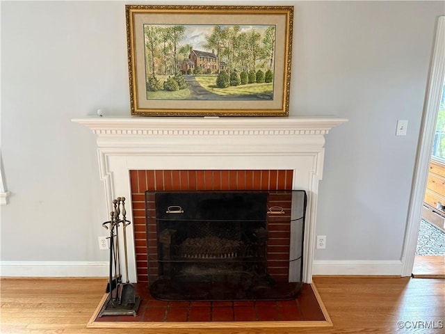 4210 Wistar Rd, Henrico, VA 23228 - detailed view of a brick fireplace, wood finished floors, and baseboards