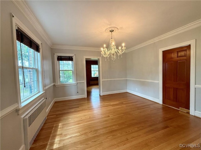 4210 Wistar Rd, Henrico, VA 23228 - spare room featuring a chandelier, light wood-style flooring, radiator, ornamental molding, and baseboards