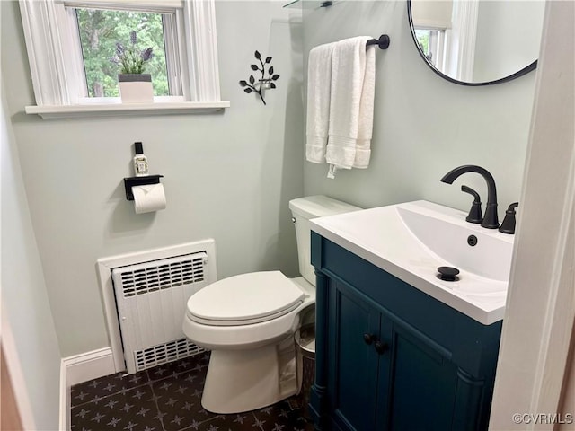 4210 Wistar Rd, Henrico, VA 23228 - bathroom with radiator heating unit, toilet, and vanity