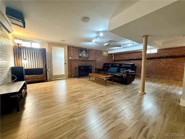 4210 Wistar Rd, Henrico, VA 23228 - living area with a fireplace, brick wall, wood finished floors, and track lighting