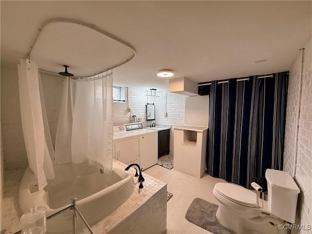 4210 Wistar Rd, Henrico, VA 23228 - bathroom with washing machine and clothes dryer, vanity, toilet, and shower / tub combo with curtain