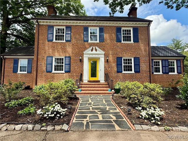 4210 Wistar Rd, Henrico, VA 23228 - colonial home featuring a chimney and brick siding