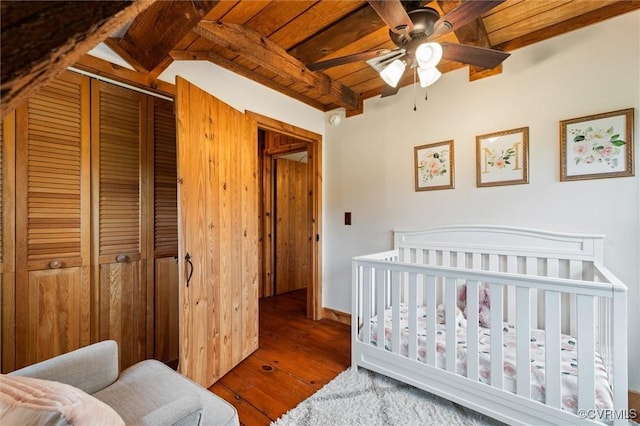 13 Bunker Blvd, Palmyra, VA 22963 - bedroom featuring hardwood / wood-style floors, wooden ceiling with exposed beams, a closet, a nursery area, and ceiling fan