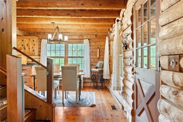 13 Bunker Blvd, Palmyra, VA 22963 - dining room with a chandelier, wood-type flooring, beam ceiling, and stairs