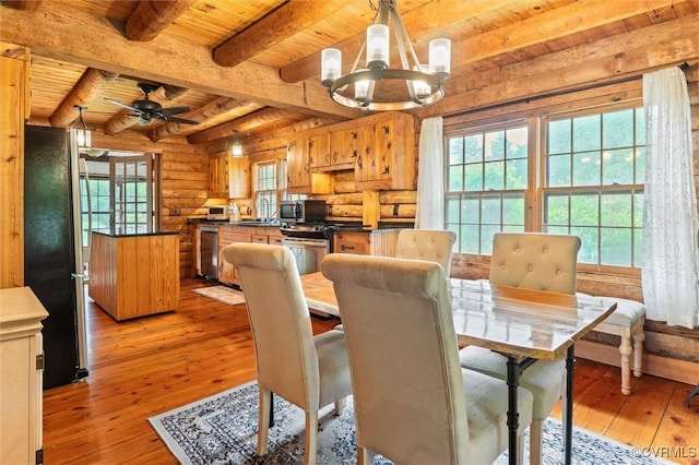 13 Bunker Blvd, Palmyra, VA 22963 - dining area featuring wood ceiling with exposed beams, a chandelier, light wood-style flooring, rustic walls, and ceiling fan