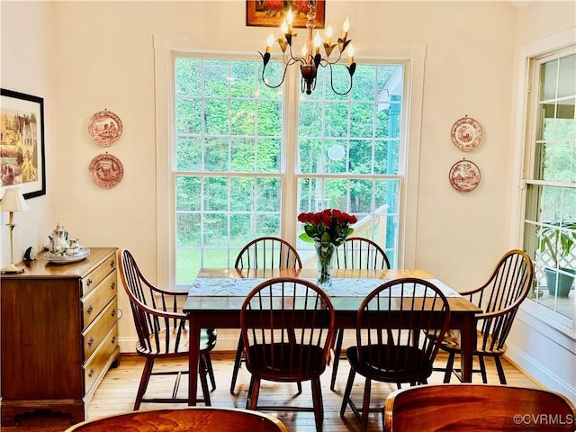 13300 Old Telegraph Rd, Providence Forge, VA 23140 - dining space featuring a chandelier, plenty of natural light, and light wood-type flooring