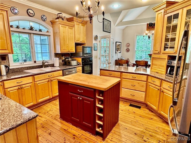 13300 Old Telegraph Rd, Providence Forge, VA 23140 - kitchen with a chandelier, butcher block countertops, black appliances, healthy amount of natural light, and crown molding