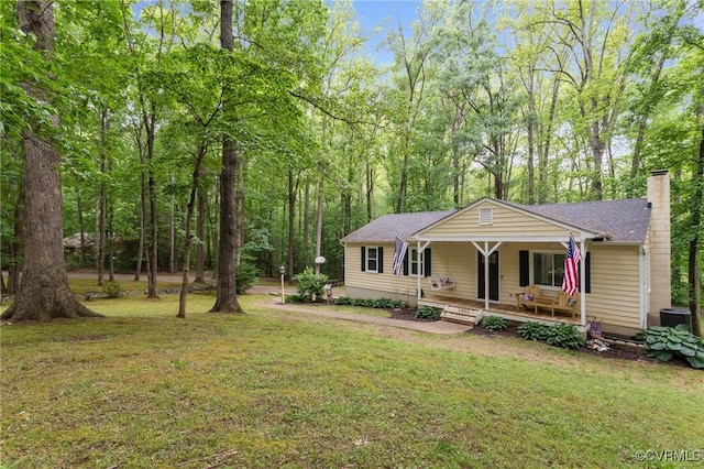 2465 W Deerpath Dr, Powhatan, VA 23139 - view of front of home featuring a porch, a front lawn, and a chimney