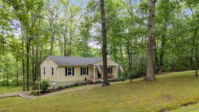 2465 W Deerpath Dr, Powhatan, VA 23139 - view of front of property with a front yard, covered porch, and a chimney