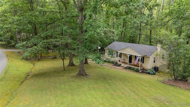 2465 W Deerpath Dr, Powhatan, VA 23139 - view of front of home featuring a porch, a front yard, a chimney, and central AC unit