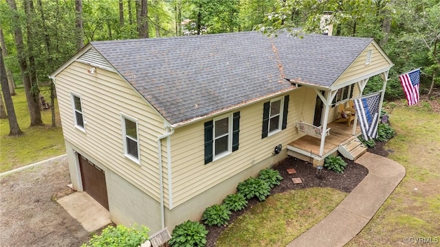 2465 W Deerpath Dr, Powhatan, VA 23139 - view of home's exterior featuring roof with shingles and a wooden deck