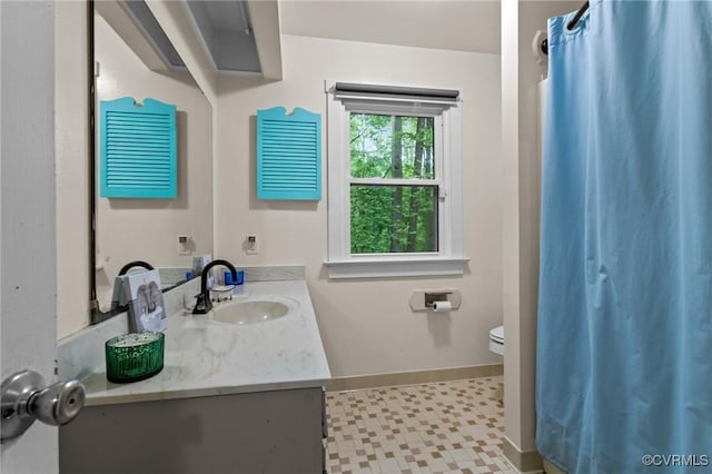 2465 W Deerpath Dr, Powhatan, VA 23139 - full bath with toilet, baseboards, vanity, and a shower with shower curtain