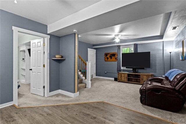 2465 W Deerpath Dr, Powhatan, VA 23139 - living area with baseboards, stairs, ceiling fan, wood finished floors, and carpet