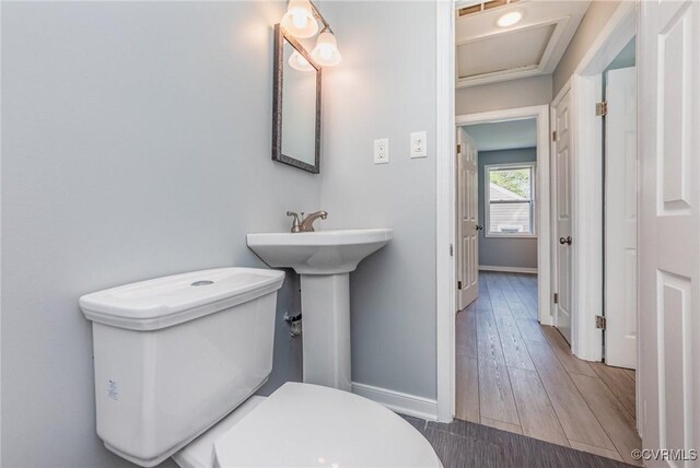 25 Cherry St, Petersburg, VA 23803 - half bath featuring baseboards, toilet, and wood finished floors