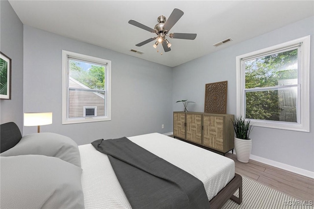 25 Cherry St, Petersburg, VA 23803 - bedroom featuring wood finished floors, baseboards, and a ceiling fan