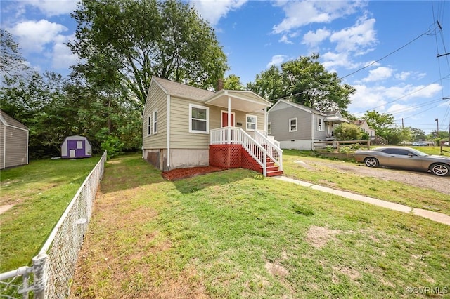 25 Cherry St, Petersburg, VA 23803 - bungalow-style house with a shed, an outbuilding, and a chimney