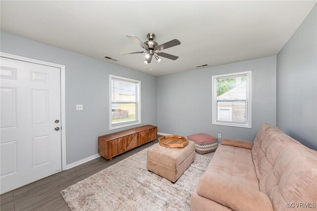 25 Cherry St, Petersburg, VA 23803 - living room with wood finished floors, a ceiling fan, and baseboards