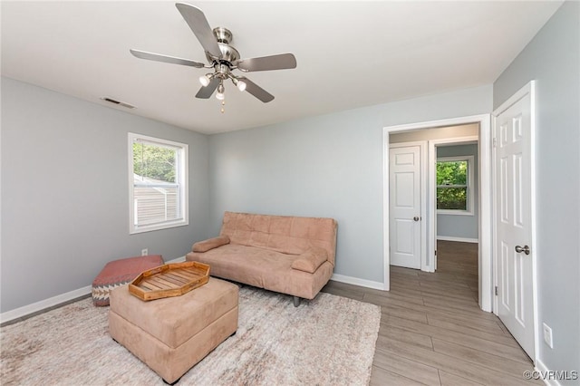 25 Cherry St, Petersburg, VA 23803 - sitting room featuring baseboards, a ceiling fan, and light wood-style floors