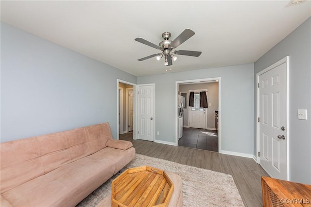 25 Cherry St, Petersburg, VA 23803 - living room with wood finished floors, ceiling fan, and baseboards