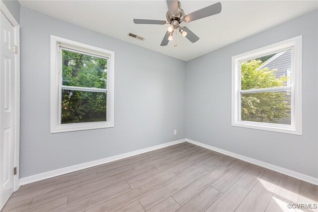 25 Cherry St, Petersburg, VA 23803 - spare room featuring plenty of natural light, wood finished floors, and baseboards