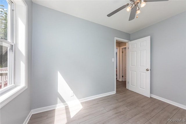 25 Cherry St, Petersburg, VA 23803 - spare room with wood finished floors, baseboards, and a ceiling fan