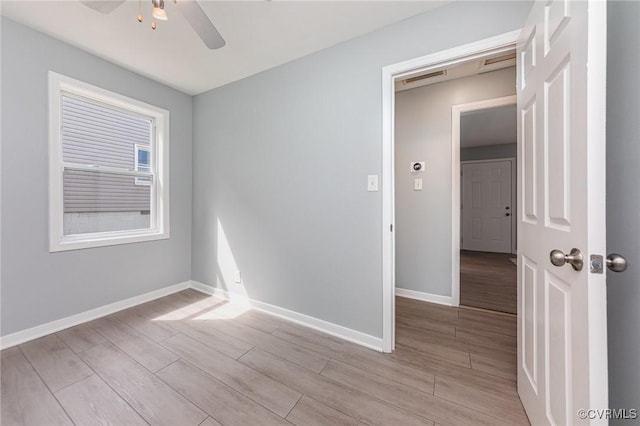 25 Cherry St, Petersburg, VA 23803 - unfurnished room with light wood-style floors, a ceiling fan, and baseboards