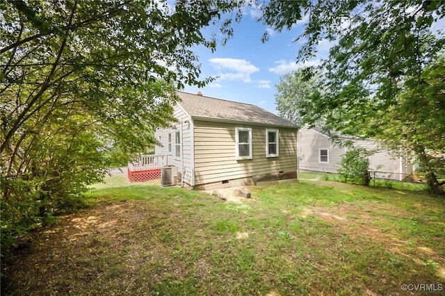 25 Cherry St, Petersburg, VA 23803 - back of house with cooling unit, crawl space, a yard, and a shingled roof