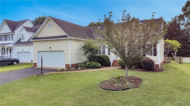 1355 Hawkins Wood Cir, Midlothian, VA 23114 - view of front of home featuring asphalt driveway, an attached garage, and a shingled roof