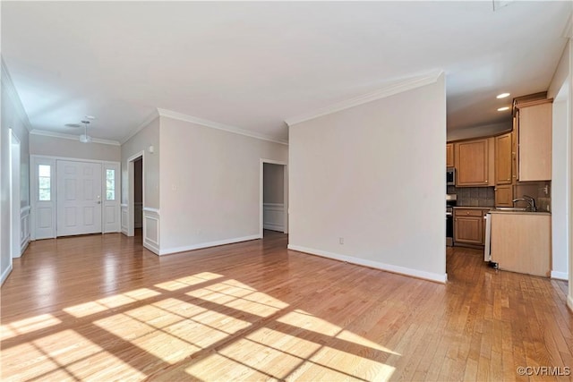 1355 Hawkins Wood Cir, Midlothian, VA 23114 - unfurnished living room with light wood-style floors, a sink, crown molding, recessed lighting, and baseboards