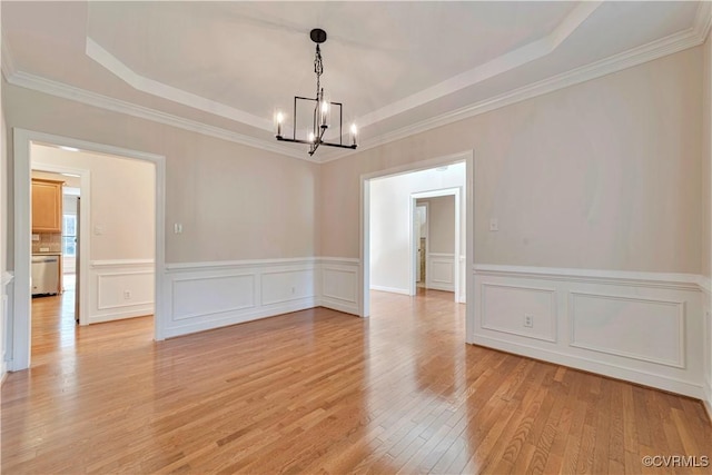 1355 Hawkins Wood Cir, Midlothian, VA 23114 - unfurnished room featuring a raised ceiling, a chandelier, light wood-style floors, wainscoting, and ornamental molding