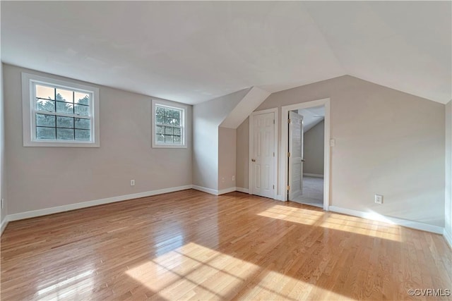 1355 Hawkins Wood Cir, Midlothian, VA 23114 - additional living space with light wood-style flooring, baseboards, and vaulted ceiling