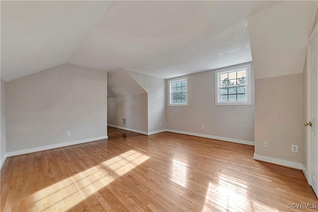 1355 Hawkins Wood Cir, Midlothian, VA 23114 - additional living space with vaulted ceiling, light wood-style floors, and baseboards