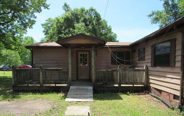 27701 W Prince Edward Hwy, Burkeville, VA 23922 - view of front of property featuring a wooden deck and a front lawn