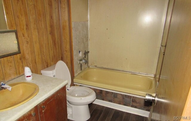 27701 W Prince Edward Hwy, Burkeville, VA 23922 - full bathroom with toilet, vanity, shower / bathtub combination, wood finished floors, and wooden walls