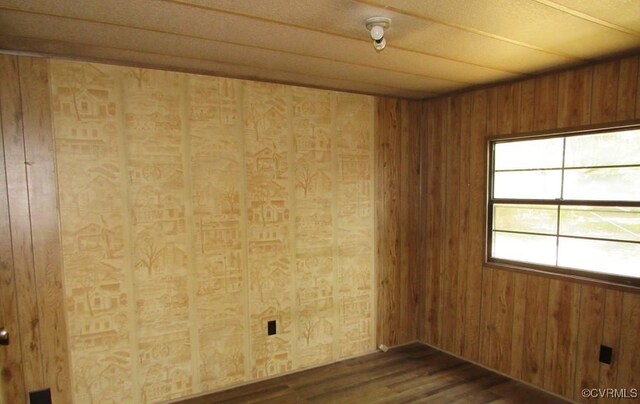 27701 W Prince Edward Hwy, Burkeville, VA 23922 - unfurnished room featuring dark wood finished floors and wood walls